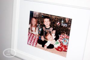 Add the perfect touch to your stairway by displaying pictures of Christmas morning.